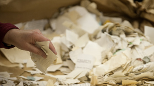 A worker in the former headquarters of the Stasi sorts hundreds of thousands of torn or shredded Stasi documents in January. Workers are sifting through thousands of bags, containing between 50,000 and 80,000 fragments each.