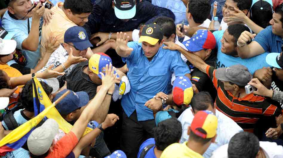 Venezuelan opposition candidate Henrique Capriles greets supporters during a campaign rally in Puerto Ayacucho.
