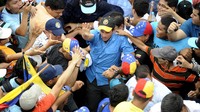Venezuelan opposition candidate Henrique Capriles greets supporters during a campaign rally in Puerto Ayacucho.