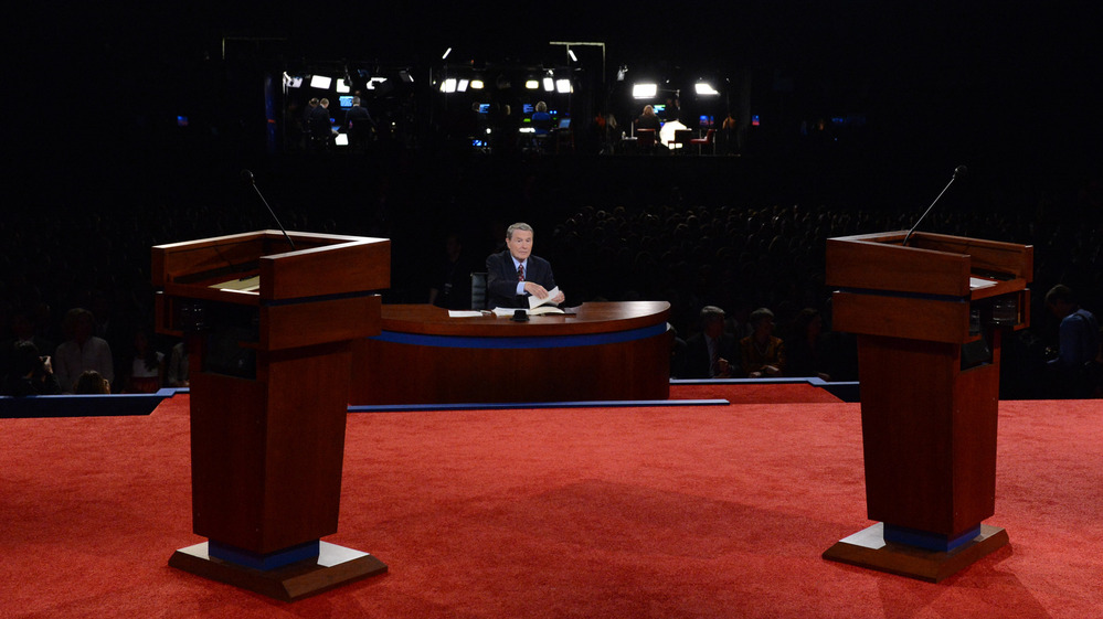 Moderator Jim Lehrer sits at his desk before last Wednesday's debate between President Obama and Republican presidential candidate Mitt Romney in Denver. For third-party candidates, getting into a presidential debate is practically impossible.