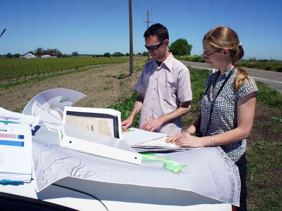 Historical ecologists Alison Whipple and Robin Grossinger study maps in California's delta, just east of San Francisco Bay.