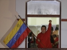President Hugo Chavez waves a Venezuelan flag as he greets supporters at the Miraflores presidential palace balcony in Caracas on Sunday. Chavez won re-election and a new endorsement of his socialist project Sunday, surviving his closest race yet after a bitter campaign against opposition candidate Henrique Capriles. President Hugo Chavez waves a Venezuelan flag as he greets supporters at the Miraflores presidential palace balcony in Caracas on Sunday. Chavez won re-election and a new endorsement of his socialist project Sunday, surviving his closest race yet after a bitter campaign against opposition candidate Henrique Capriles.