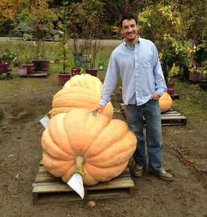 Topher Mallory stands next to the pumpkin he turned into a first-place-winning power boat. Topher Mallory stands next to the pumpkin he turned into a first-place-winning power boat.