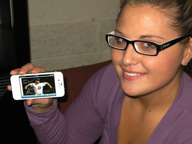 Sarah Wagner shows off an Egraph of Kerry Wood, her favorite Cubs player.
