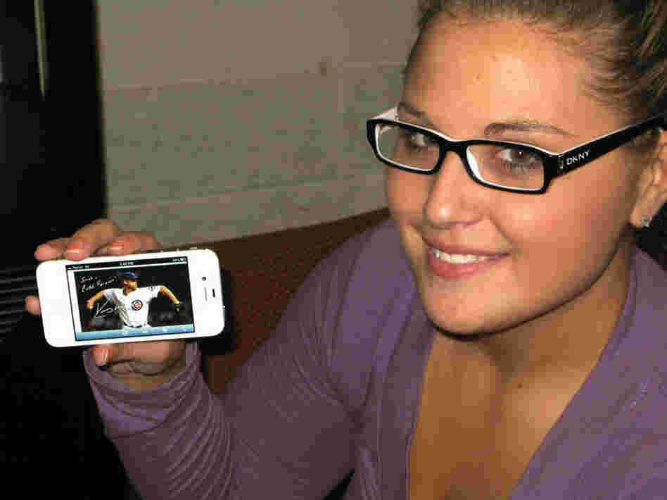 Sarah Wagner shows off an Egraph of Kerry Wood, her favorite Cubs player.