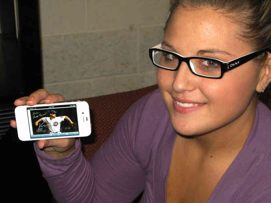 Sarah Wagner shows off an Egraph of Kerry Wood, her favorite Cubs player.