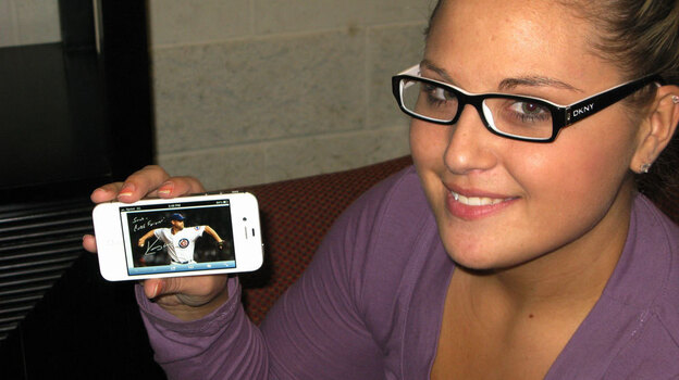 Sarah Wagner shows off an Egraph of Kerry Wood, her favorite Cubs player. (NPR)
