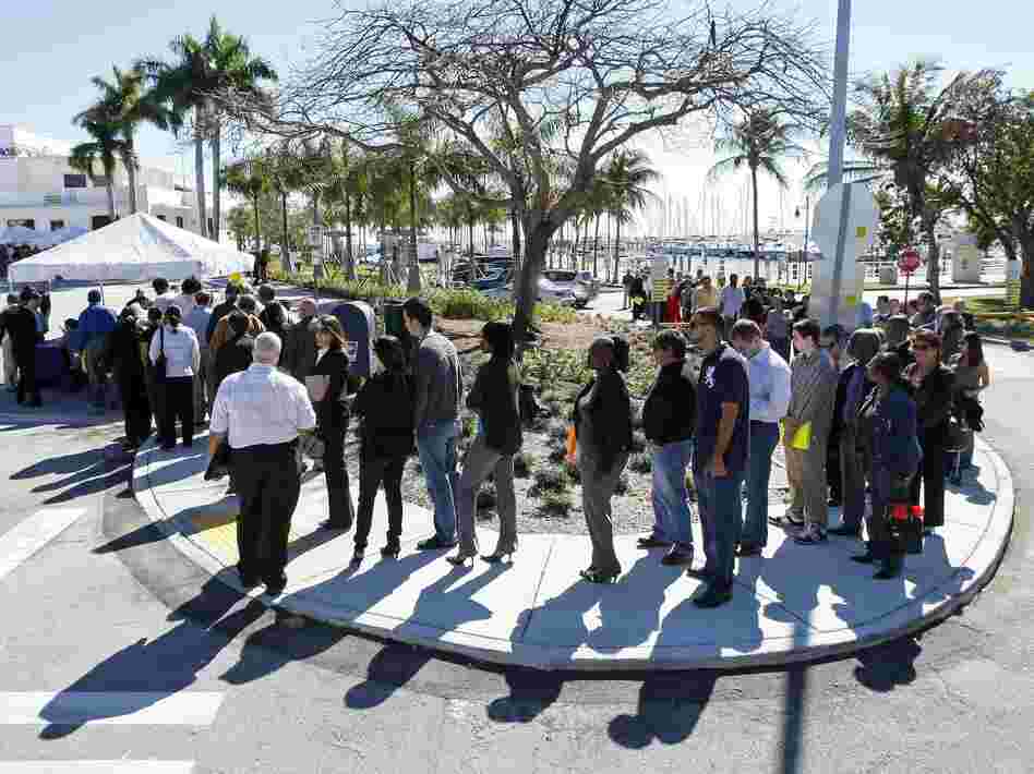 Job seekers line up to register at a Miami job fair in January. A new study shows that Florida voters discuss joblessness in ways quite different from those in Ohio and Virginia, two other presidential battleground states.