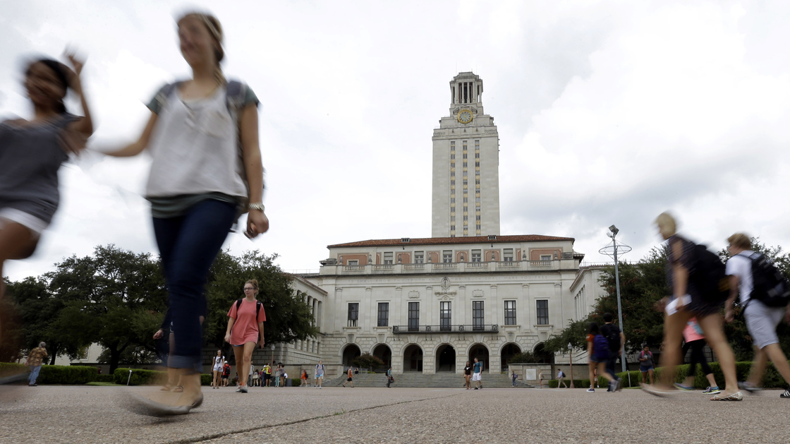 Students walk through the University of Texas, Austin, campus near the school's iconic tower on Sept. 27.