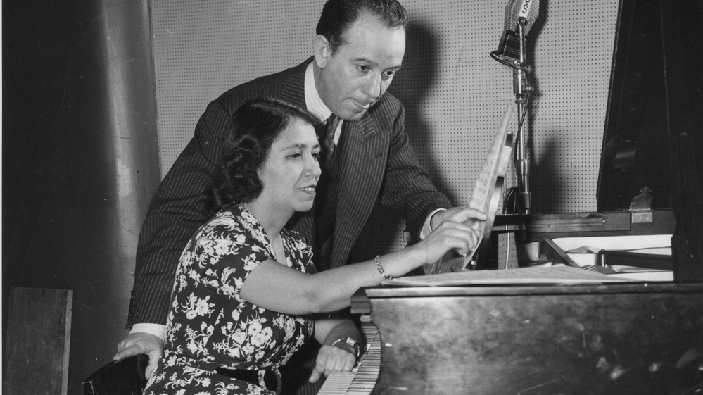 Clotilde Arias (seated) with composer and arranger Terig Tucci, circa 1943.