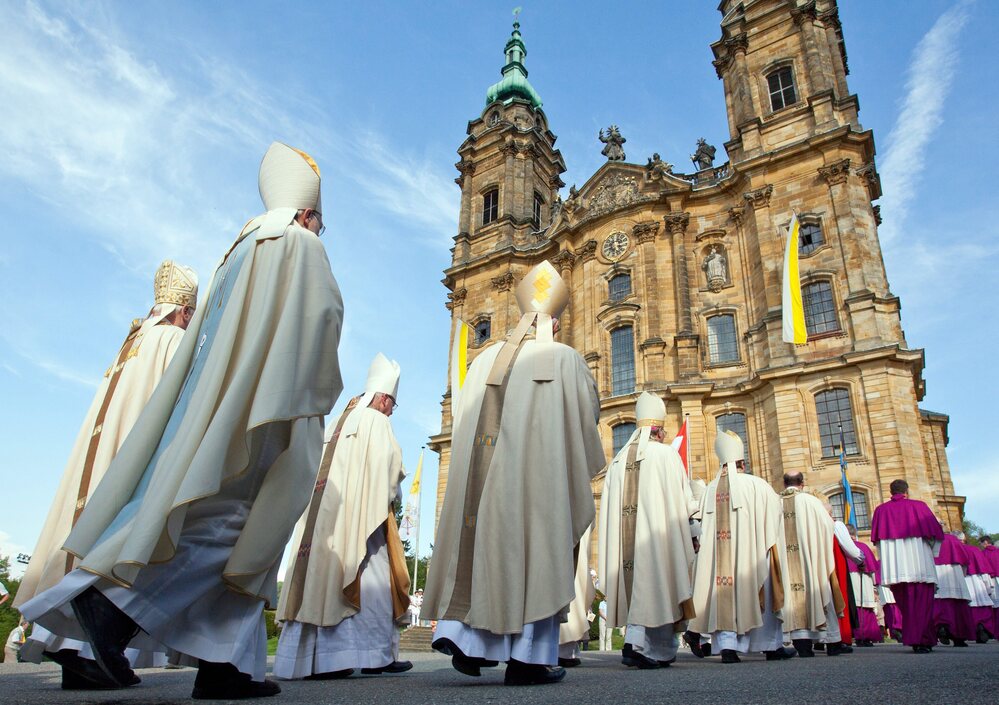 Bavarian bishops walk in a procession to the Basilica of the Fourteen Holy Helpers near Bad Staffelstein, Germany, in May. A decree by the German bishops' conference warns that German Catholics who do not pay a state church tax will be denied sacraments.
