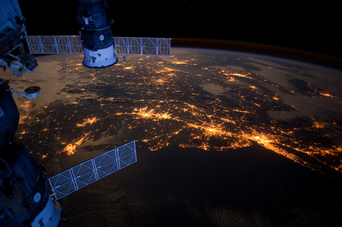 This nighttime photograph taken from the International Space Station shows much of the Atlantic coast of the United States. Parts of two Russian vehicles parked at the orbital outpost can also be seen in the frame.