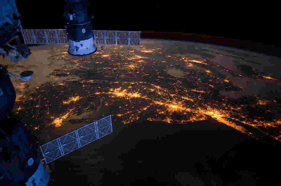 This nighttime photograph taken from the International Space Station shows much of the Atlantic coast of the United States. Parts of two Russian vehicles parked at the orbital outpost can also be seen in the frame.