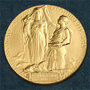 The medal for the Nobel in Physics. According to the Nobel committee, the inscription reads: " 'Inventas vitam juvat excoluisse per artes' loosely translated 'And they who bettered life on earth by their newly found mastery.' " The medal for the Nobel in Physics. According to the Nobel committee, the inscription reads: " 'Inventas vitam juvat excoluisse per artes' loosely translated 'And they who bettered life on earth by their newly found mastery.' "
