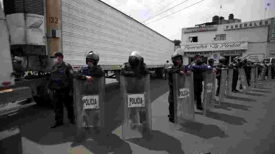 Sept. 1, 2010: Police stood guard by a truck containing some of the bodies of immigrants killed by members of the Zetas drug cartel in Tamaulipas state. Sept. 1, 2010: Police stood guard by a truck containing some of the bodies of immigrants killed by members of the Zetas drug cartel in Tamaulipas state.