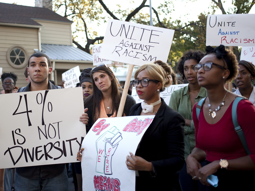 Students rally Oct. 3 in the wake of reports of water balloon attacks on minority students at the University of Texas at Austin. Campus police are investigating the incidents.