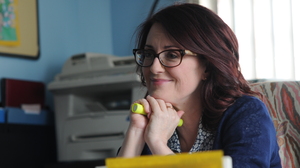 Kate lies to her boss, Principal Barnes (Megan Mullally), about being pregnant in order to hide her drinking problem.