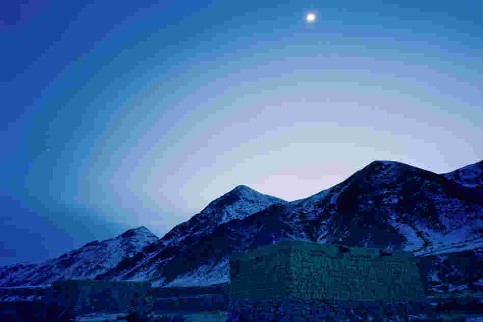 Photographed at dusk, the mud-and-thatch house of Jimira, the third daughter of the Kuruman family, is situated high in the Tianshan mountains.