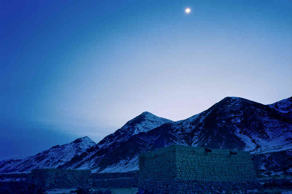 Photographed at dusk, the mud-and-thatch house of Jimira, the third daughter of the Kuruman family, is situated high in the Tianshan mountains.