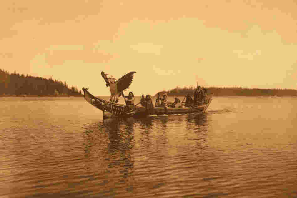 The book caption reads: " ... a masked [Kwakiutl] man personating the thunderbird, dances with characteristic gestures as the canoe approaches the bride's village."