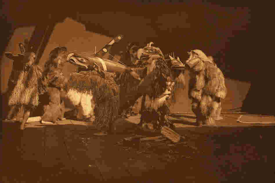 In his book, Curtis identifies this as a Kwakiutl "group of winter dancers." Curtis (and later, his team of photographers) had unprecedented access to sacred ceremonies.