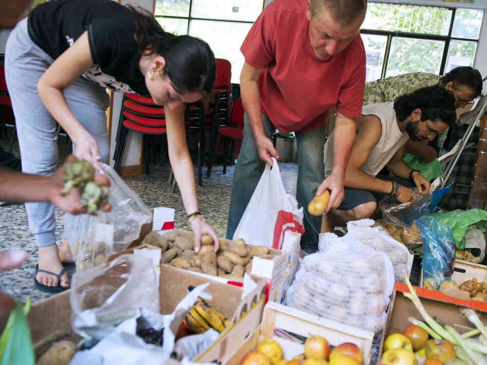 In June, people in Madrid came to a distribution center where those in need could get food.