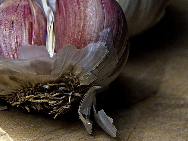 Garlic's papery skin slips off quick after a little turn in the microwave. Yes, the microwave is back.