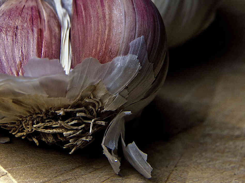Garlic's papery skin slips off quick after a little turn in the microwave. Yes, the microwave is back.