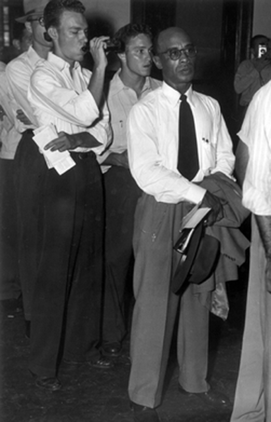 Heman Sweatt in line for registration at the University of Texas in 1950. Heman Sweatt in line for registration at the University of Texas in 1950.