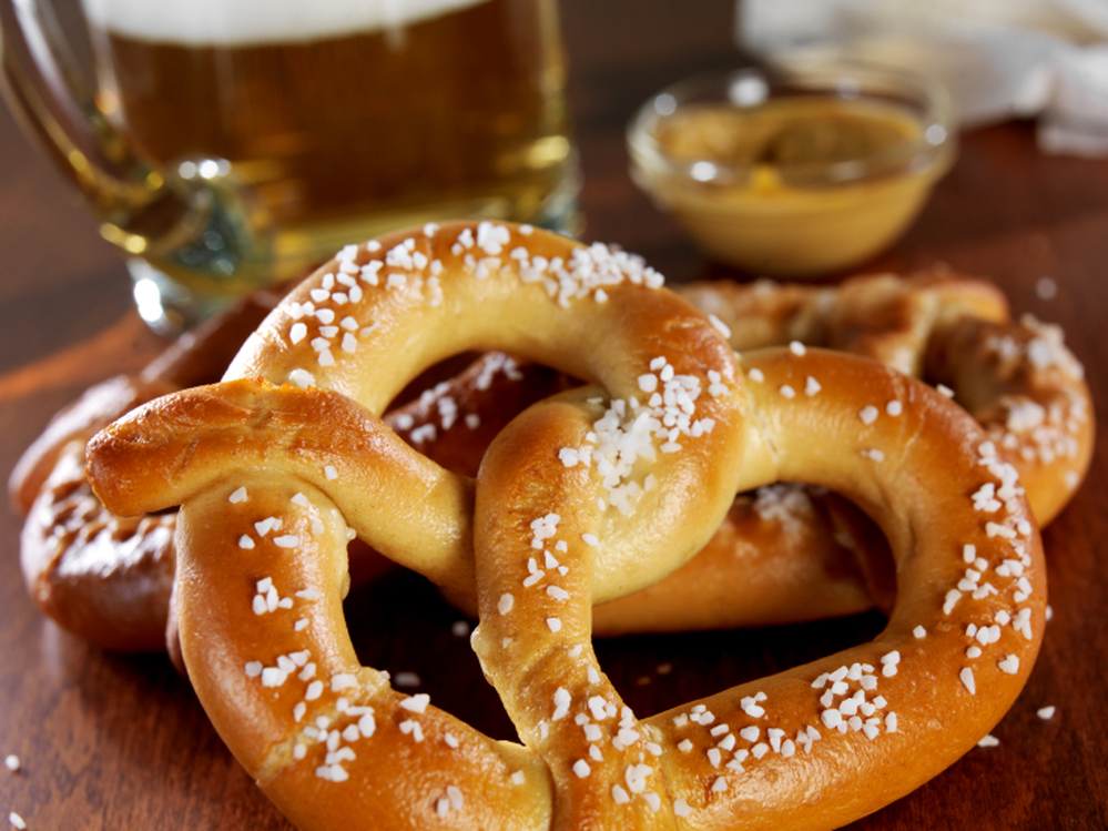 Taking a bite out of a salty pretzel can actually enhance the bitterness of your beer. That's one reason pretzels and beer work as a pair.