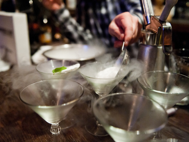 A bartender prepares cocktails using liquid nitrogen at Bourbon and Branch in San Francisco.