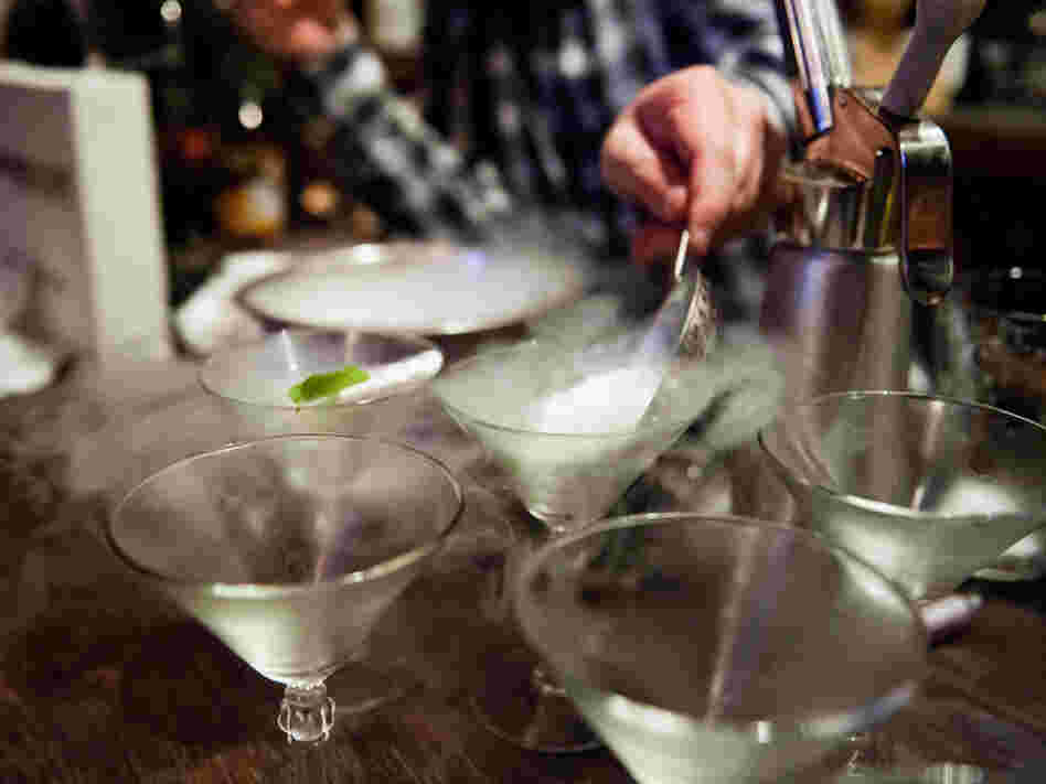 A bartender prepares cocktails using liquid nitrogen at Bourbon and Branch in San Francisco.