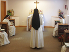A nun chants while she and her sisters pray together during Vespers at their home near Dumfries, Va. Unlike older sisters shaped by Vatican II, a new generation of women are flocking to more conservative orders. A nun chants while she and her sisters pray together during Vespers at their home near Dumfries, Va. Unlike older sisters shaped by Vatican II, a new generation of women are flocking to more conservative orders.