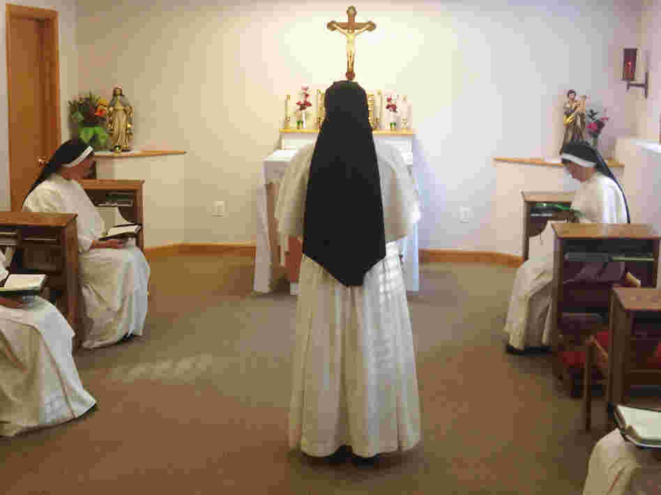 A nun chants while she and her sisters pray together during Vespers at their home near Dumfries, Va. Unlike older sisters shaped by Vatican II, a new generation of women are flocking to more conservative orders. A nun chants while she and her sisters pray together during Vespers at their home near Dumfries, Va. Unlike older sisters shaped by Vatican II, a new generation of women are flocking to more conservative orders.