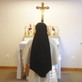 A nun chants while she and her sisters pray together during Vespers at their home near Dumfries, Va. Unlike older sisters shaped by Vatican II, a new generation of women are flocking to more conservative orders.