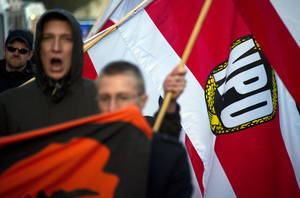 Members of the German far-right party NPD (National Democratic Party) wave the party's flags during a demonstration in Berlin on April 13. The party, which glorifies the Third Reich, has won two seats in parliament and in various municipalities.