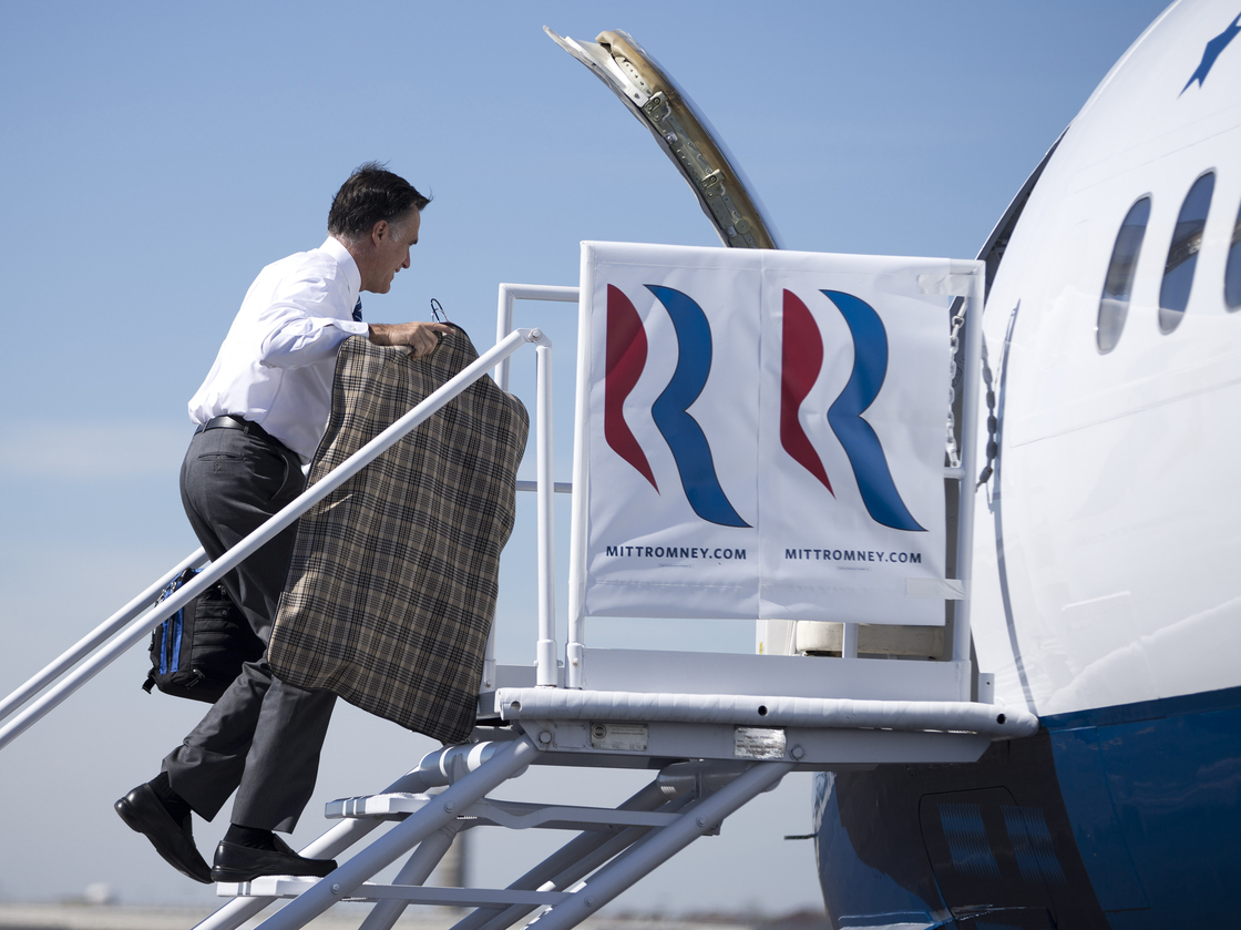 Republican presidential nominee Mitt Romney boards his campaign plane Thursday in Dayton, Ohio, for a flight to North Carolina. In comments to The Columbus Dispatch, Romney said uninsured Americans don't die from a lack of health care.