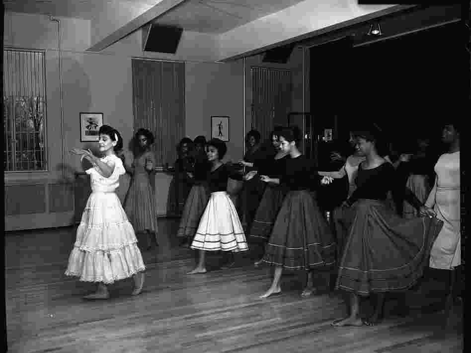 Argentine dancer instructing a group of young women behind her in a dance at Howard University in February 1963.