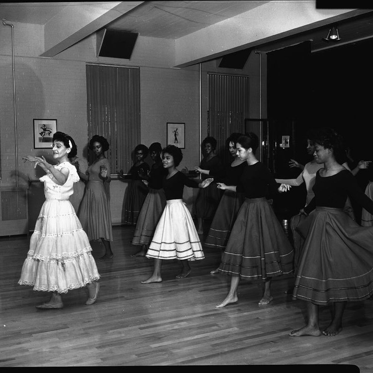 Argentine dancer instructing a group of young women behind her in a dance at Howard University in February 1963.