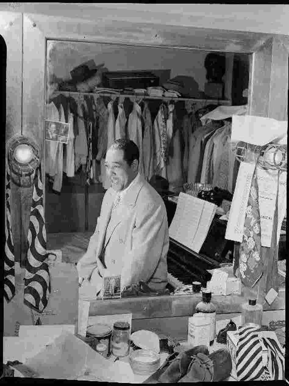 Duke Ellington, amid "his 20 suits, 15 shirts, suede shoes and his ever present piano" in his dressing room at the Paramount Theater in New York in September 1946.