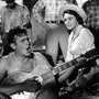 Andy Griffith playing guitar as Patricia Neal watches in a scene from the Elia Kazan's A Face In The Crowd. Andy Griffith playing guitar as Patricia Neal watches in a scene from the Elia Kazan's A Face In The Crowd.