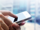 A person holds a smartphone. A person holds a smartphone.