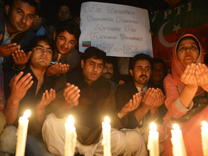 Supporters of the political party Pakistan Tehreek-e-Insaaf pay tribute to Malala in Islamabad on Wednesday.
