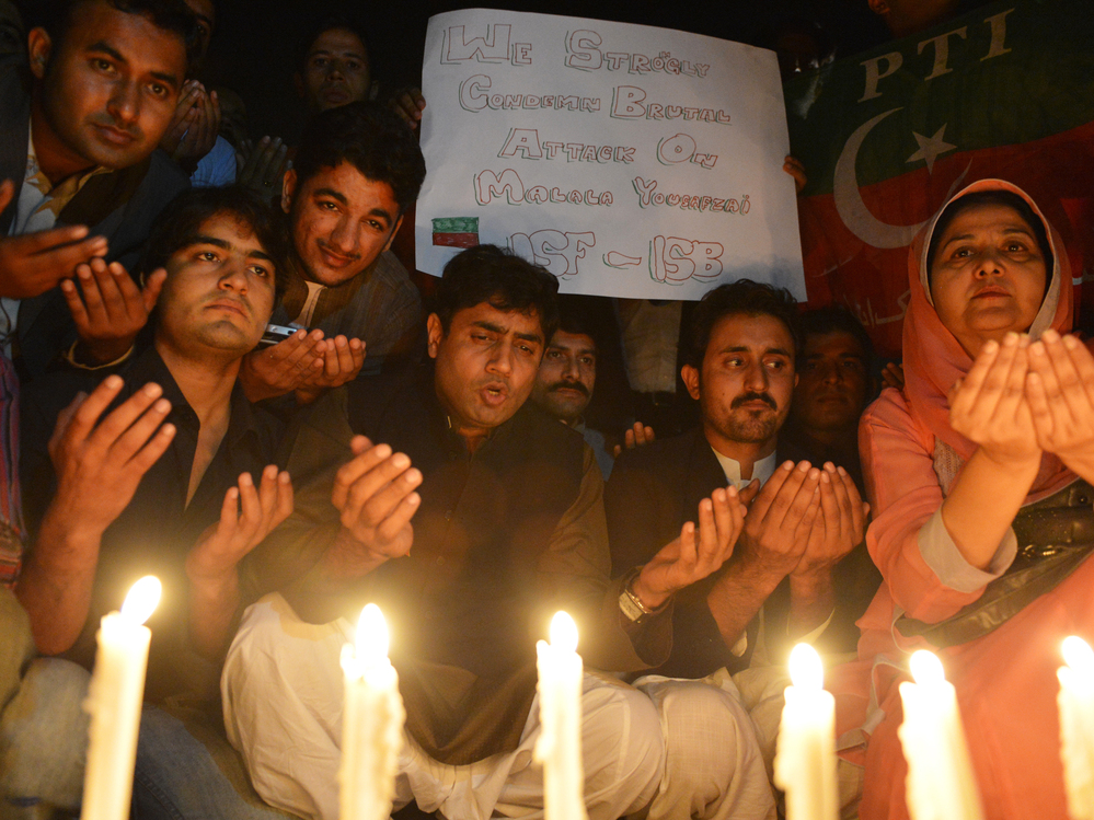 Supporters of the political party Pakistan Tehreek-e-Insaaf pay tribute to Malala in Islamabad on Wednesday.