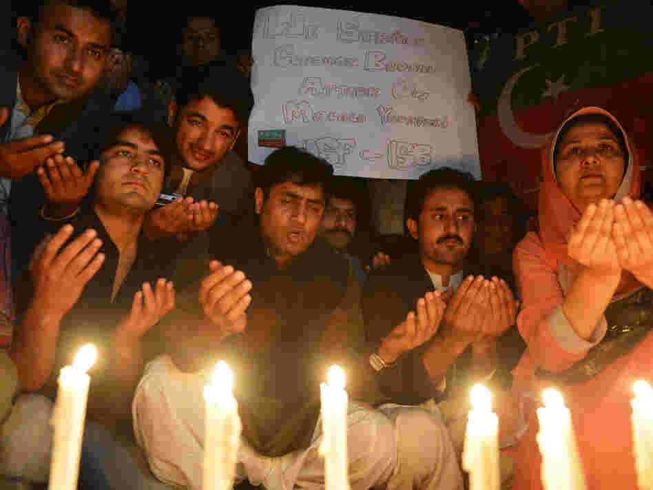 Supporters of the political party Pakistan Tehreek-e-Insaaf pay tribute to Malala in Islamabad on Wednesday.