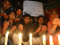 Supporters of the political party Pakistan Tehreek-e-Insaaf pay tribute to Malala in Islamabad on Wednesday.