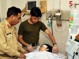 Malala Yousafzai is treated in a hospital in Peshawar, Pakistan, after she was shot on Tuesday.