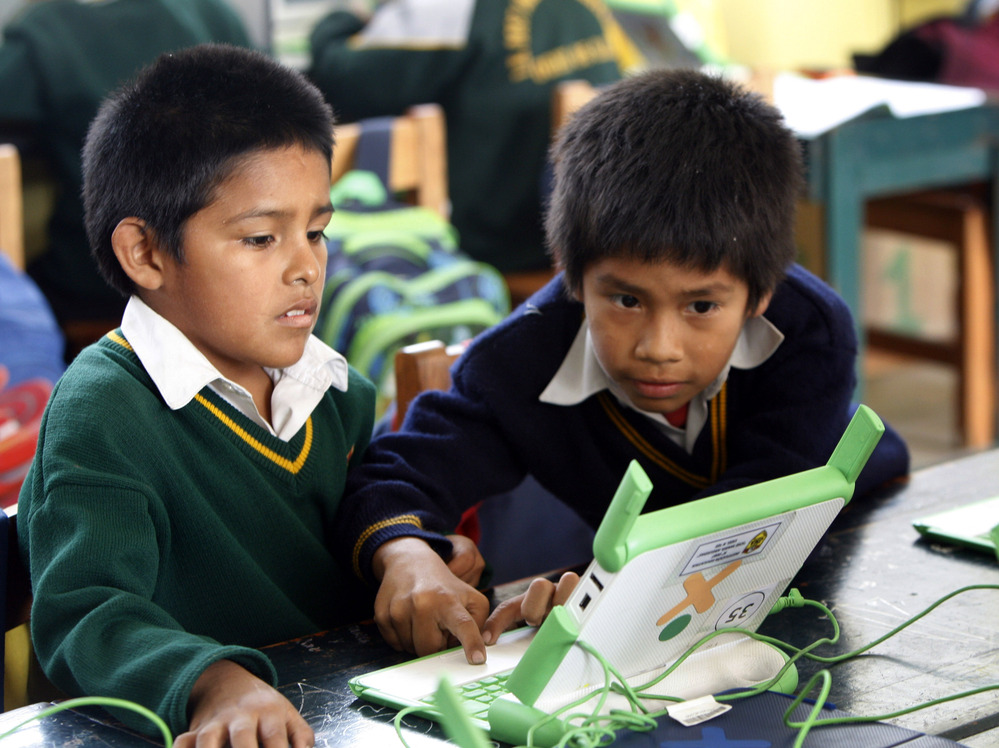 Students use a laptop at the Jose Maria public school in a shantytown on the outskirts of Lima, Peru on June 8. Peru has sent more than 800,000 laptop computers to children across the country, one of the world's most ambitious efforts to leverage digital technology in the fight against poverty. Five years into the program, there are doubts about its success.