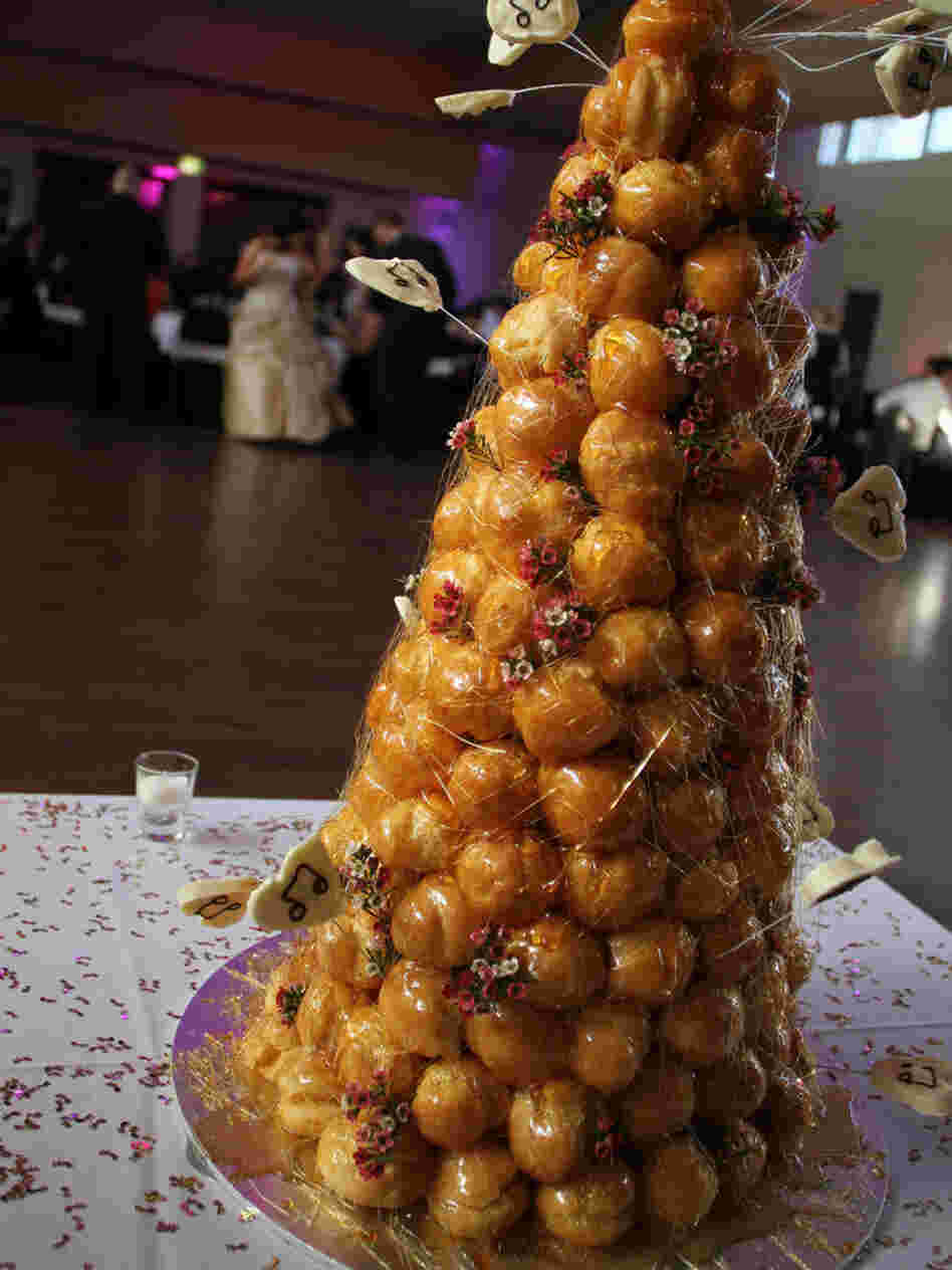 A tower of profiteroles like this one, known as croquembouche, was created in France to celebrate Maillard, the man credited with identifying a key reaction in food science.