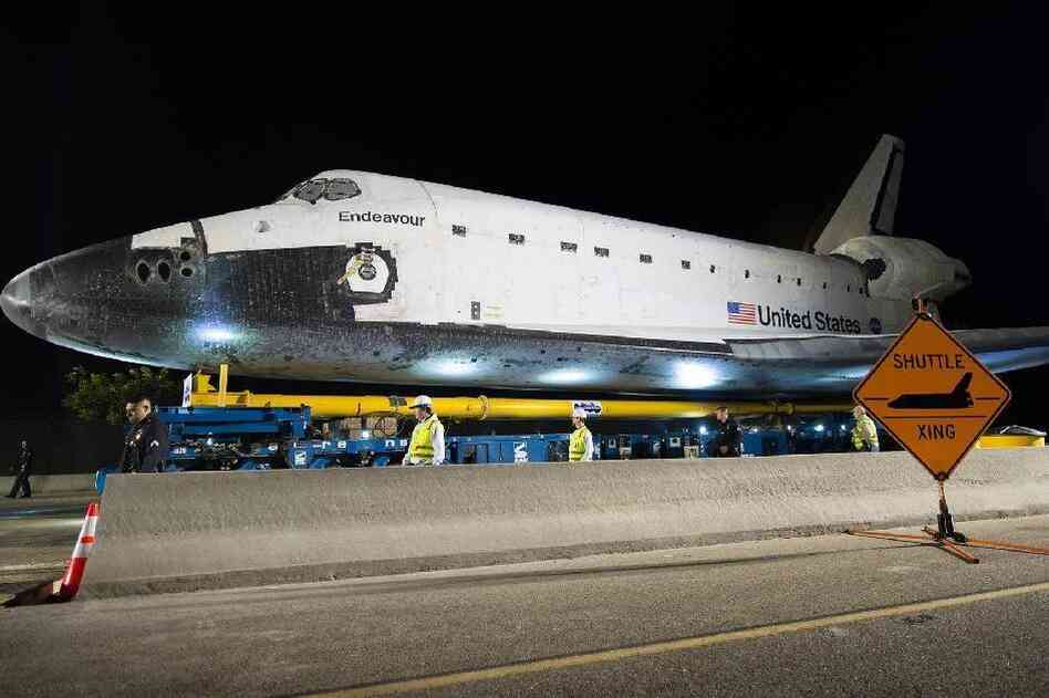 The space shuttle Endeavour is seen atop the Over Land Transporter after exiting the Los Angeles International Airport on its way to its new home at the California Science Center in Los Angeles